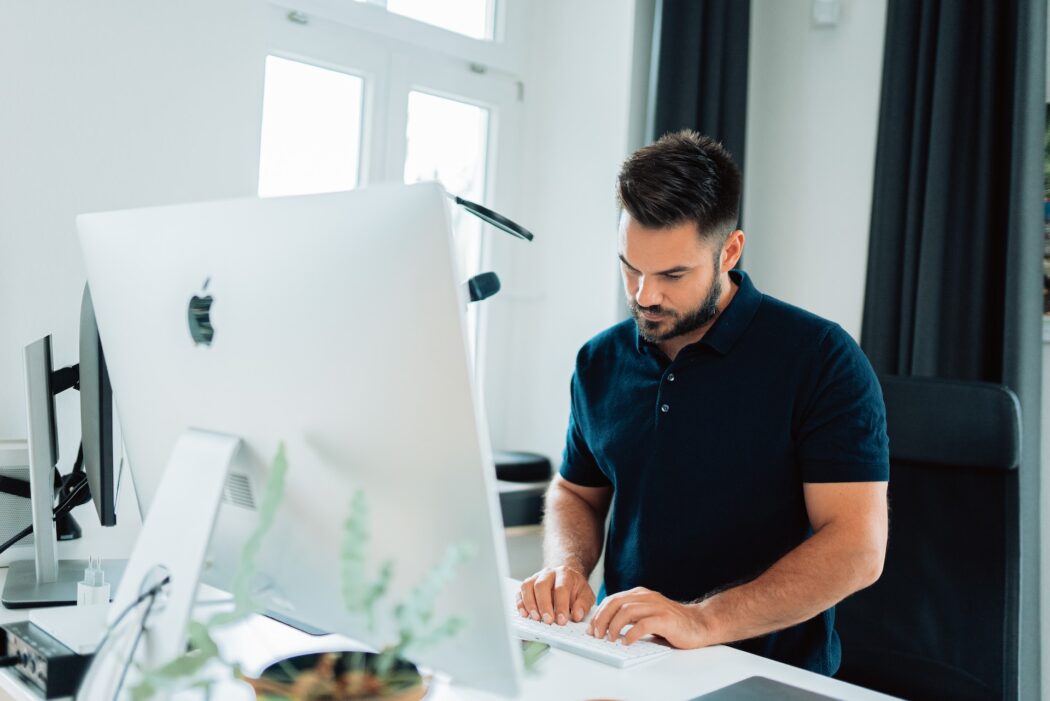 man typing on a keyboard