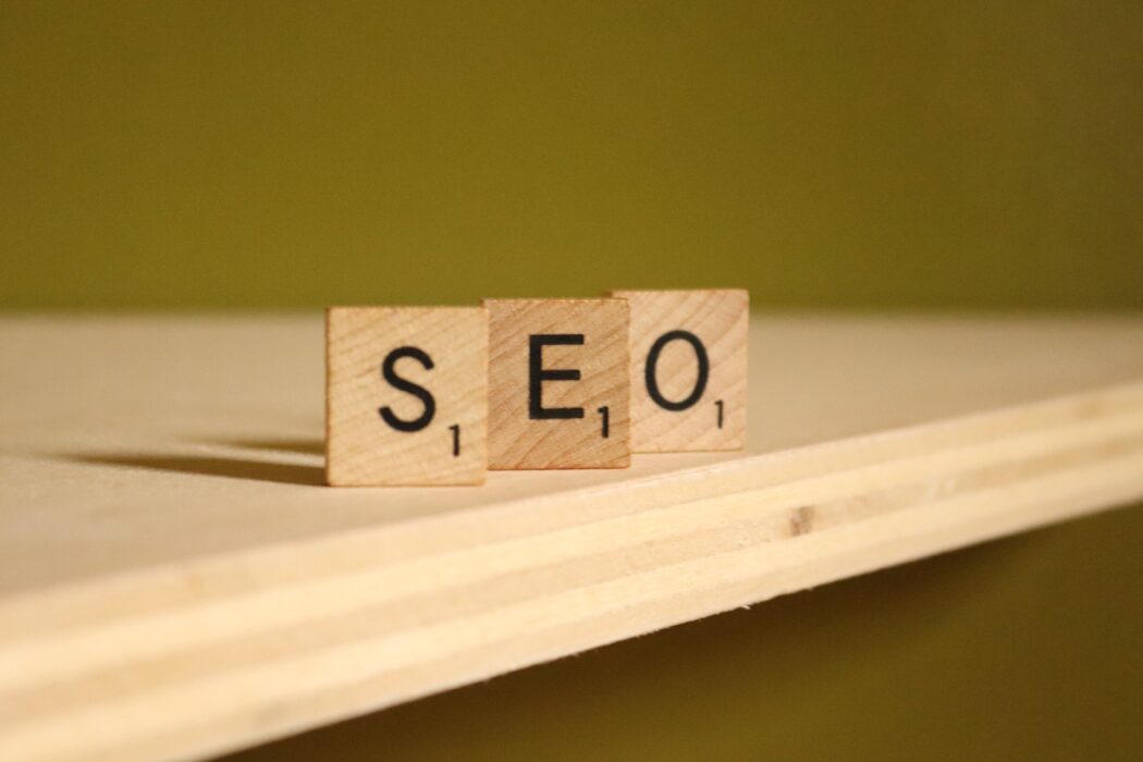 composing the word SEO from wooden cubes
